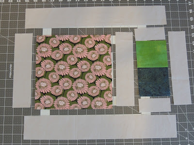 The placemat pattern uses a focus fat quarter and basic fabrics