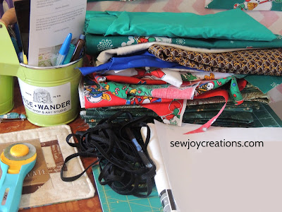 cutting table quilt fabric pile