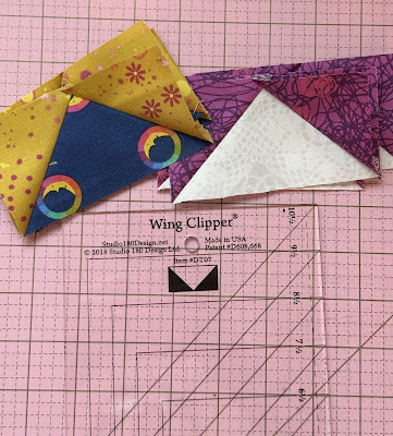 wing clipper ruler and flying geese units wing clipper ruler from studio 180 design with trimmed flying geese quilt blocks on cutting mat