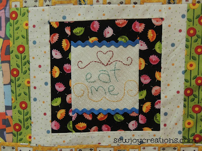 handstitch quilt block with ric rac on alice in wonderland quilt