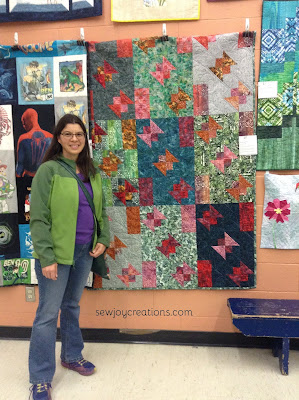 quilter with butterfly quilt
