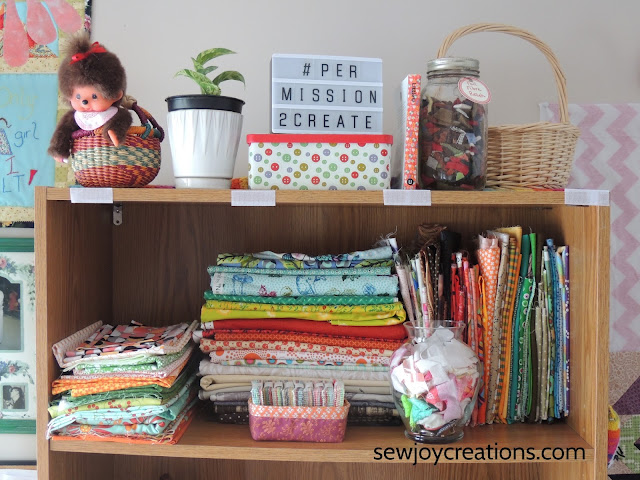 fabric folded bookcase display quilt room sewing room