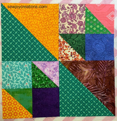 Color Play with Half Square Triangles – Green Four Patch block